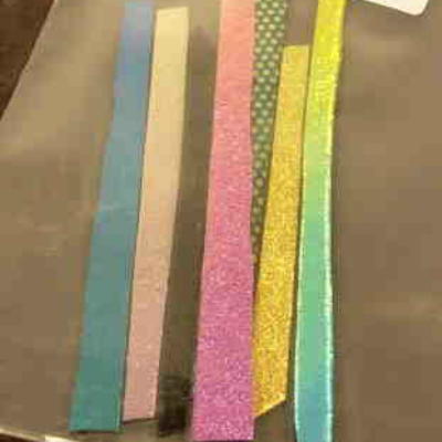 1 oz Assorted Black Dichroic Strips on Effetre Glass 1 oz pkg