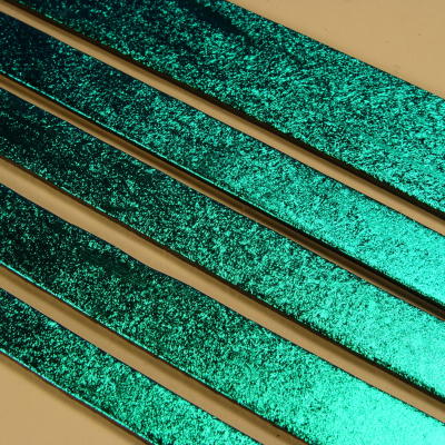 Teal Dichroic on Black Strips of Effetre Glass