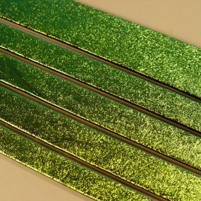 Green Dichroic on Black Strips of Effetre Glass
